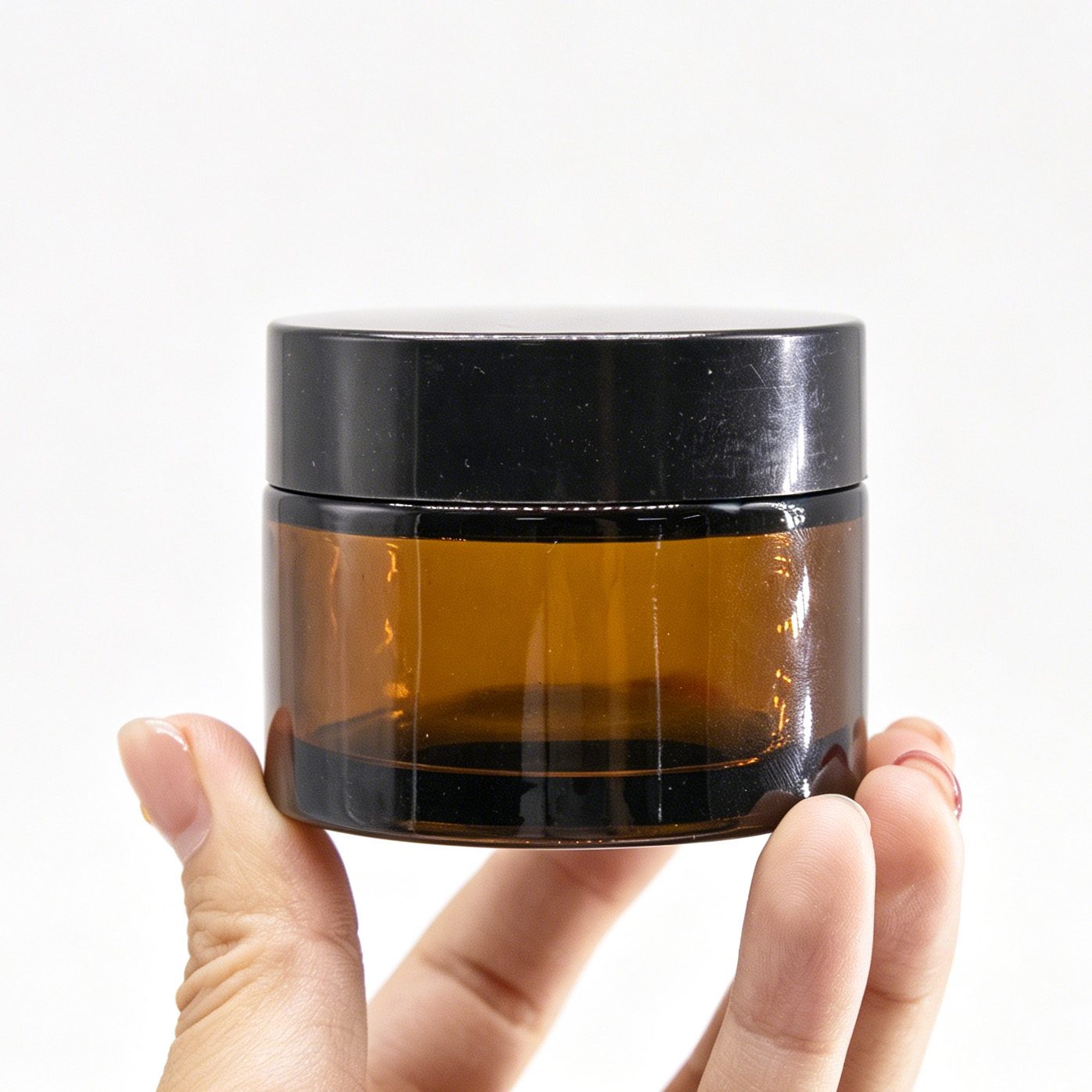 Amber cream jar with black lid — 3