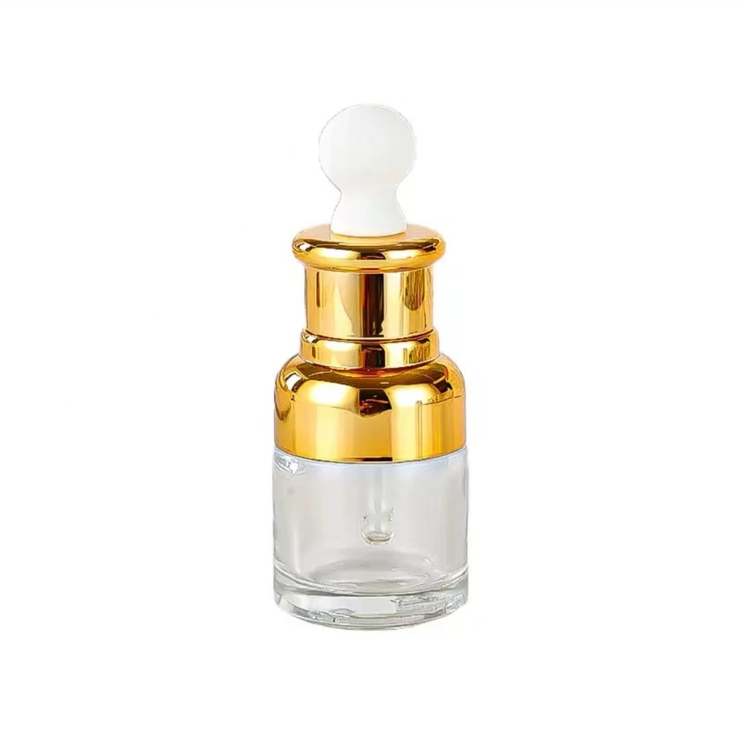 Dropper bottle with gold or silver collar 
