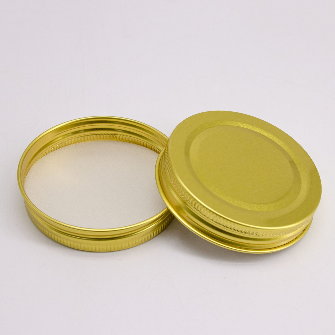 Gold metal lug caps for food jars 